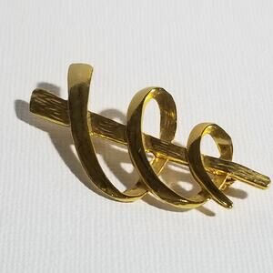 Vintage JJ smooth and textured gold tone spiral brooch